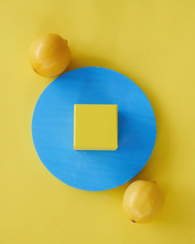 Yellow Surface with lemons and some Shapes, by Daria Liudnaya from Pexels